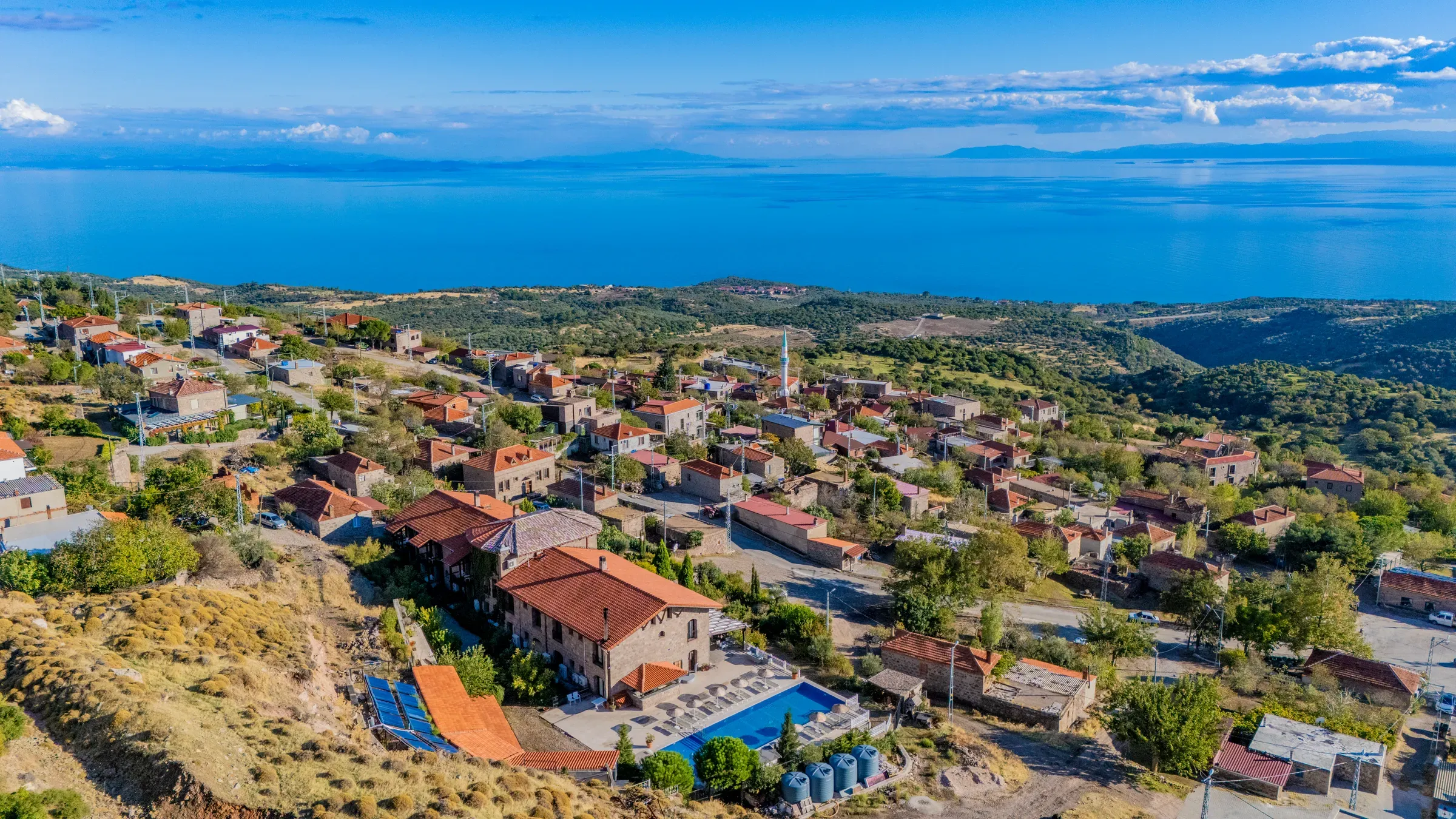Aerial view of the hotel, Büyükhusun village and the Aegean