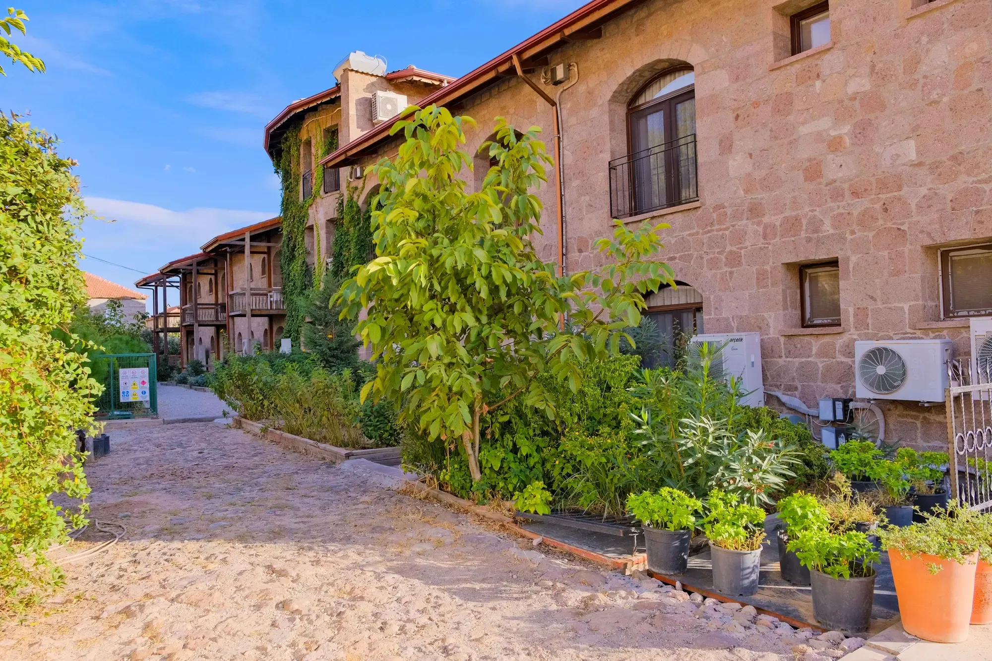 Stone hotel and ivy-covered courtyard