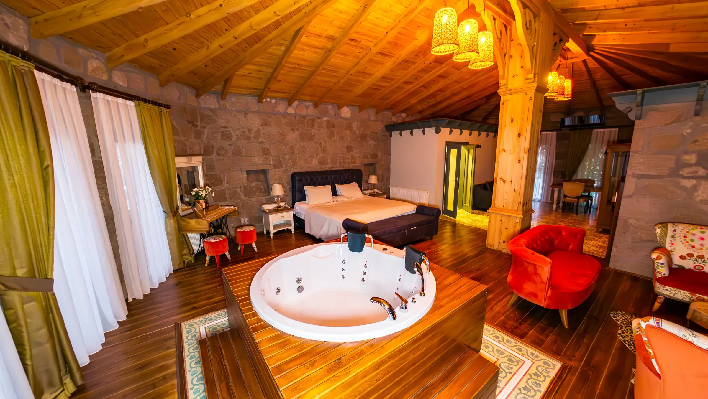 The Honeymoon Suite with its wooden ceiling, stone walls and jacuzzi